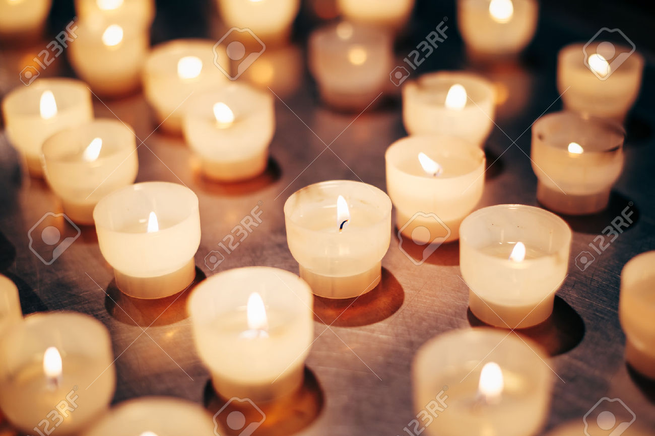 42865655-Group-Of-Candles-In-Church-Candles-Light-Background-Candle-Flame-At-Night--Stock-Photo